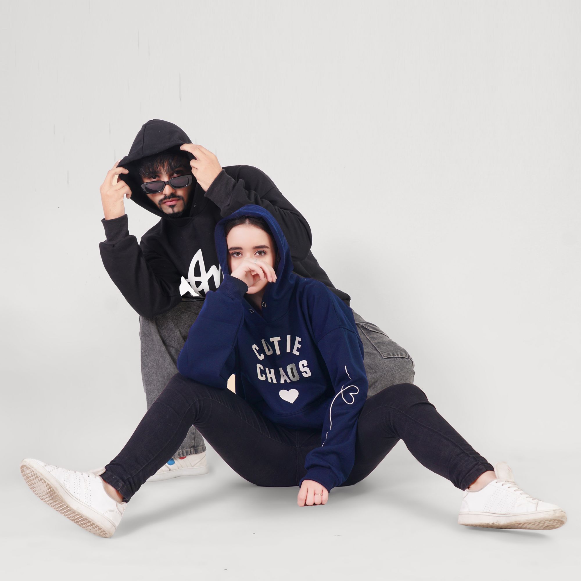 Static Heavyweight Hoodie — Sand Two models wearing ALIENWEAR hoodies in a studio